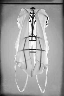 A transparent sheer dress with steel construction underneith